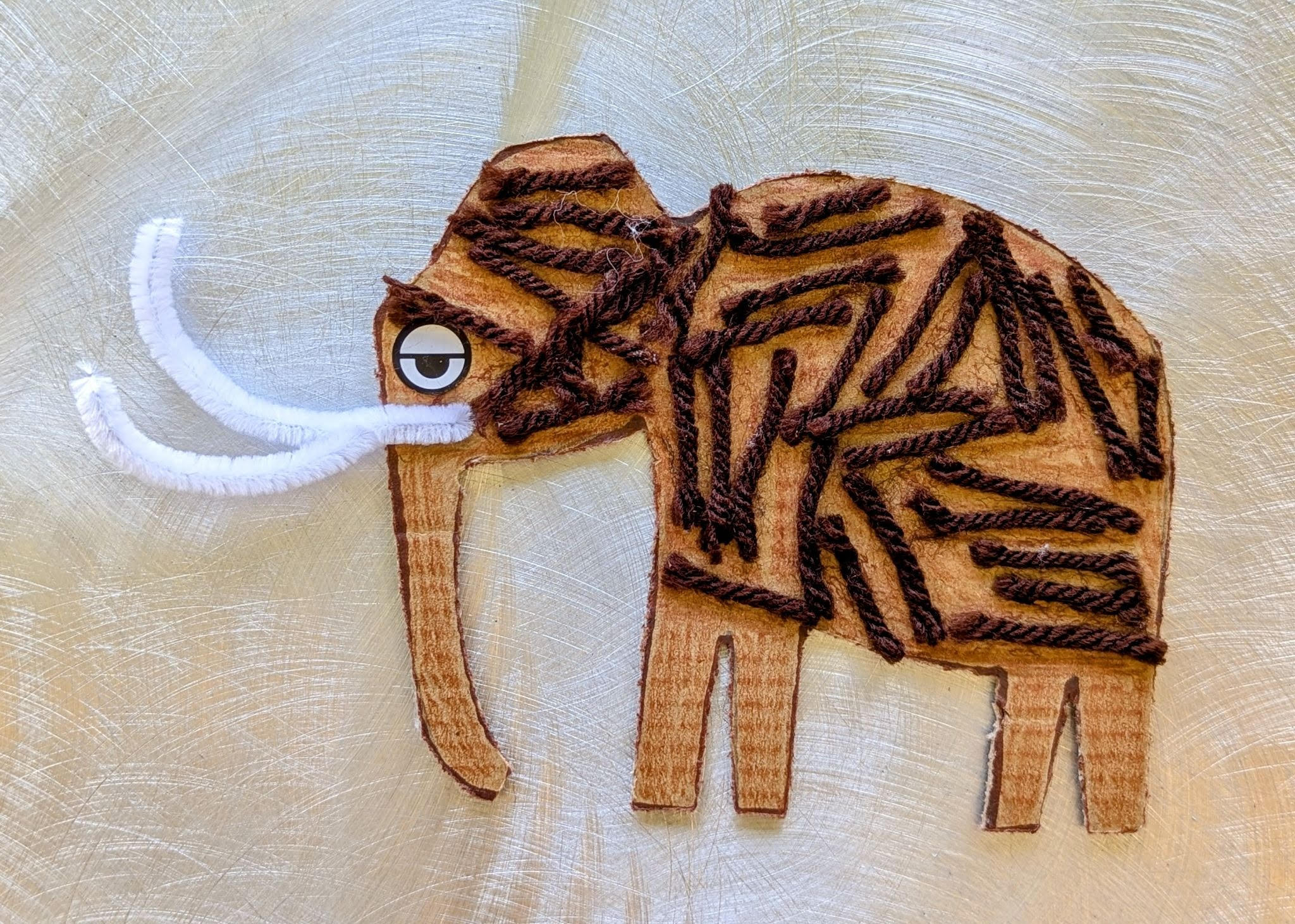cardboard woolly mammoth craft with yarn hair